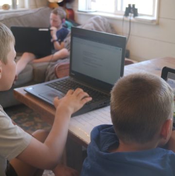 boys homeschooling with computer